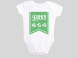 Lucky St. Patrick's Day Baby Bodysuit with Irish Shamrock Clovers on a Green Banner